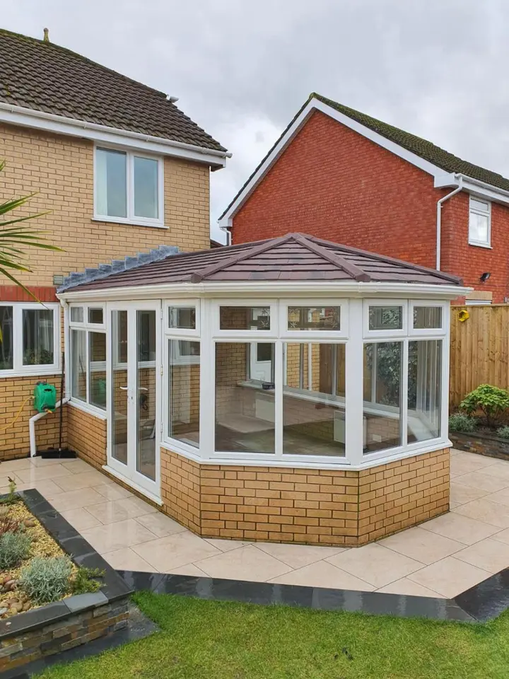 Same conservatory after replacement with a solid tiled roof